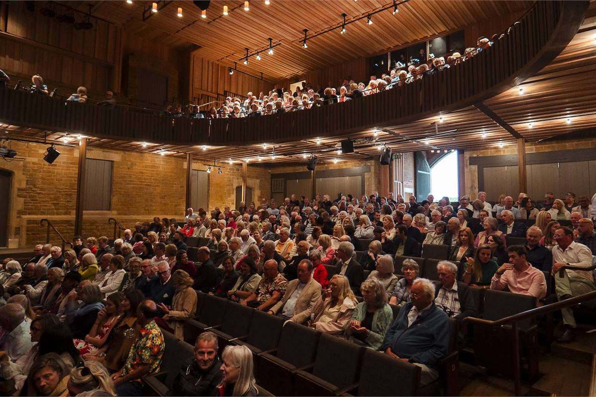 A full house in the Nevill Holt Theatre auditorium at Nevill Holt Festival. Photo by William Blakesley-Herbert