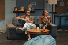 Finn Jones and Anna Camp on the sofa in rehearsal for 2:22 – A Ghost Story. Photo by Langley Hayman