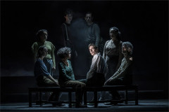 Samuel Collings as Sydney Carton with members of the company in A Tale of Two Cities. Photo by Marc Brenner