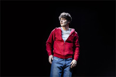 Noah Schnapp in a spotlight in Affluenza at Riverside Studios. Photo by Danny Kaan