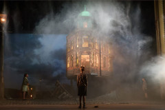 The Birling house wreathed in smoke in An Inspector Calls, 2024 UK touring company. Photo by Mark Douet