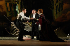 A confrontation in front of the wrecked house in An Inspector Calls, 2024 UK touring company. Photo by Mark Douet