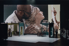 A scene from ENO's Angel's Bone at the London Coliseum, with live video above the set. Photo by Nirah Sanghani
