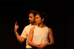 The couple side by side, one gesturing mid-argument. Photo by Deven Ahire