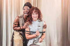 Aminita Francis (Vida) and Emma Manton (Agave) in the National Theatre's schools tour of Bacchae. Photo by Marc Brenner