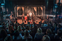 The company performing to a school audience in the National Theatre's schools tour of Bacchae. Photo by Marc Brenner