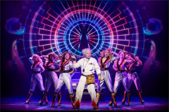 Roger Bart as Doc Brown and the company. Photo by Mark Senior