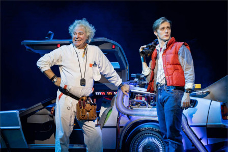 Roger Bart as Doc Brown and Axel Duffy as Marty McFly beside the DeLorean in the Back to the Future The Musical UK tour. Photo by Mark Senior