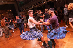 Kilted dancers lead the floor in Ceilidh the Musical