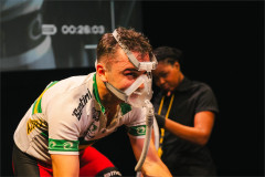 Connor Delves in a breathing mask, with Mecca Christy behind him in Cadel: Lungs On Legs at Riverside Studios. Photo by Kyle Dax Smith