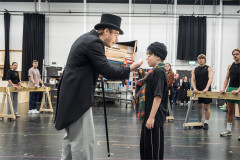 Jonny Fines (Willy Wonka) and Lucas Kerr (Charlie Bucket) in rehearsal for Charlie and the Chocolate Factory at Curve. Photo by Marc Brenner