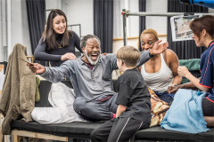 Molly Lynch (Mrs Bucket), David-Michael Johnson (Grandpa Joe), Lucas Kerr (Charlie Bucket), Michelle Cornelius (Grandma Josephine) and Thea Jo Wolfe (Grandma Georgina) in rehearsal. Photo by Marc Brenner