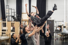 Lucas Kerr (Charlie Bucket) and the company of Charlie and the Chocolate Factory in rehearsal. Photo by Marc Brenner
