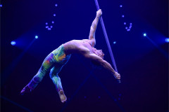 The Snap Dragonfly act on a flying pole in Cirque Alice, from an earlier staging