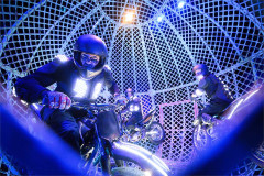 A rider in the Globe of Death, with two more motorcyclists behind, in Cirque Berserk! at the Garrick Theatre. Photo by Jonathan Hordle