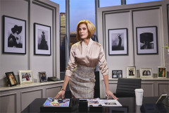 Teri Hatcher as Miranda Priestly in a satin blouse, leaning on her Runway desk, The Devil Wears Prada. Photo by Matt Crockett