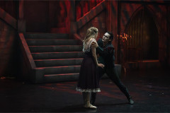 A couple dance at the foot of a staircase in BIG Live's Dracula