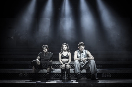 Diego Rodriguez as Che, Rachel Zegler as Eva Perón and James Olivas as Juan Perón in Evita at the London Palladium. Photo by Marc Brenner