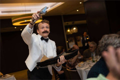 Manuel mid-service with a bread basket at Faulty Towers The Dining Experience. Photo by That’s Up