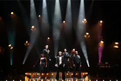 The company of From The Heart under coloured spotlights at the Garrick Theatre. Photo by Eamonn B Shanahan