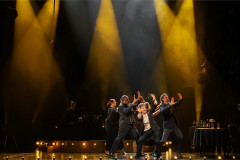The cast of From The Heart in a routine under gold spotlights. Photo by Eamonn B Shanahan