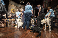 Puppies, raisers and cast spread across the Cornley Polytechnic Drama Society set. Photo by Ellie Kurttz