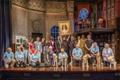 The company of The Play That Goes Wrong with seven Guide Dogs puppies in training and their volunteer puppy raisers on stage at the Duchess Theatre. Photo by Ellie Kurttz