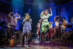 The company of Hadestown mid-leap at the Lyric Theatre, original West End cast. Photo by Marc Brenner
