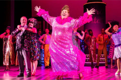 Edna Turnblad and the company in a previous UK tour of Hairspray. Photo by Pamela Raith