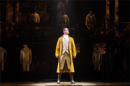 Stephenson Ardern-Sodje as Alexander Hamilton with the company of Hamilton at the Victoria Palace Theatre. Photo by Danny Kaan