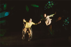 Jen Chandler and Elvie Rose Christiansen Head hold hands with arms outstretched against projected foliage in Learn From Us. Photo by Luke Waddington
