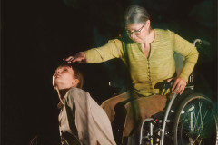 Jen Chandler holds a hand above Elvie Rose Christiansen Head&rsquo;s upturned face. Photo by Luke Waddington