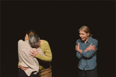 Jen Chandler and Elvie Rose Christiansen Head embrace while Melanie Pappenheim stands apart, arms folded across her chest. Photo by Luke Waddington