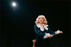Jordana Belaiche as Little Lord Fondleroy under a single spotlight