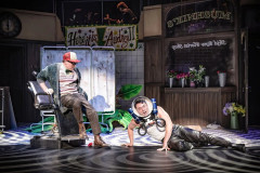 Scott McClure (Seymour) and Ross Clifton (Orin Scrivello) in the dentist scene in Little Shop of Horrors at Exeter Northcott Theatre. Photo by Craig Fuller
