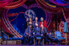 Satine, Christian, Harold Zidler and the Bohemians gathered beneath the moon in Moulin Rouge! The Musical. Photo by Johan Persson Satine, Christian, Harold Zidler and the Bohemians gathered beneath the moon in Moulin Rouge! The Musical. Photo by Johan Persson