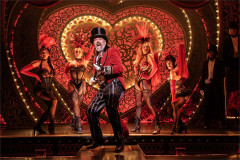 Harold Zidler and the Moulin Rouge dancers in Moulin Rouge! The Musical at the Piccadilly Theatre. Photo by Johan Persson