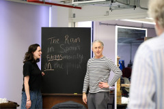 Alan Cumming at a blackboard reading The Rain in Spain, in rehearsal for My Fair Lady. Photo by Chris Keatch