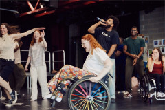 National Youth Theatre members rehearsing a number with a microphone for Letters to My Younger Future Self. Photo by Rich Lakos