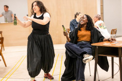 One Day cast members rehearse a party scene. Photo by Pamela Raith