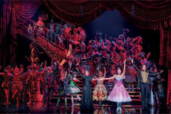 The company of The Phantom of the Opera masked on the Opera House staircase. Photo by Johan Persson