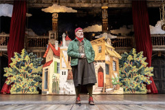A scene in Pinocchio’s painted village from the 2025 production at Shakespeare’s Globe. Photo by Johan Persson