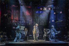 Gaten Matarazzo (Mark), Travis Ross (Roger) and the company of Rent. Photo by Pamela Raith