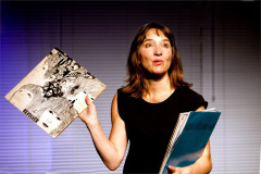 Emily Woof holding a copy of The Beatles album Revolver in Revolver at Soho Theatre. Photo by Sheila Burnett