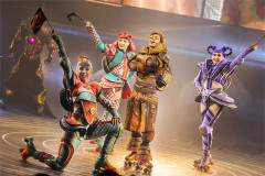 Engines celebrate on the track, one waving a chequered flag in Starlight Express at the Troubadour Wembley Park Theatre. Photo by Pamela Raith