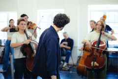 The string players of the company in rehearsals for The Pianist. Photo by Rich Southgate