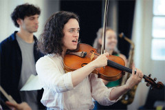 Two violinists rehearse for The Pianist. Photo by Rich Southgate
