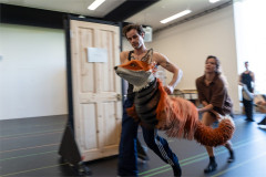 A dancer works the fox puppet in rehearsal for Birmingham Rep’s new The Snowman. Photo by Johan Persson