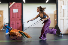 A dancer steers the pheasant puppet in rehearsal for The Snowman. Photo by Johan Persson