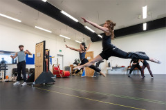 A dancer leaps across the rehearsal room for The Snowman. Photo by Johan Persson